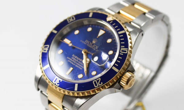 Rolex Submariner Armbanduhr Herren mit Datumsanzeige aus Stahl und Gold blaues Zifferblatt Faltschliesse 